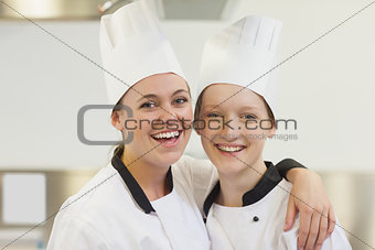 Two chefs smiling