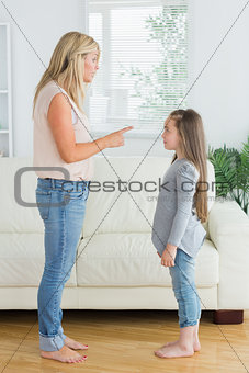 Mother giving out to daughter