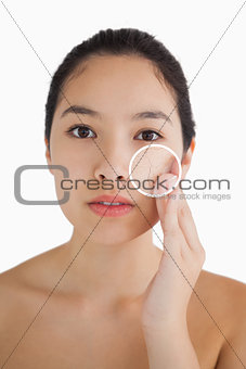 Cute woman touching her skin with close up of her wrinkles