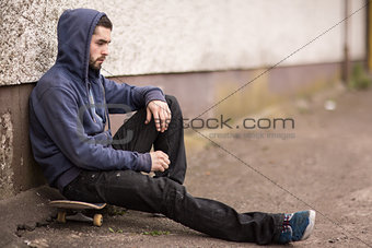 Skater taking a break outside the skate park