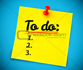 Yellow post it with a to do list written on it