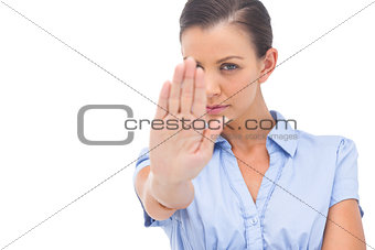 Businesswoman saying stop with hand