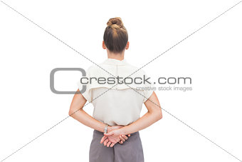 Businesswoman with hands behind her back