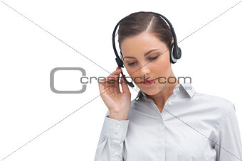 Businesswoman listening to caller on headset