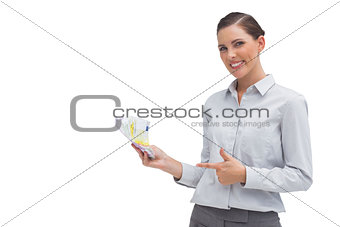 Happy businesswoman showing money in her hand