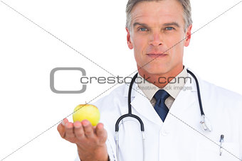 Doctor showing apple