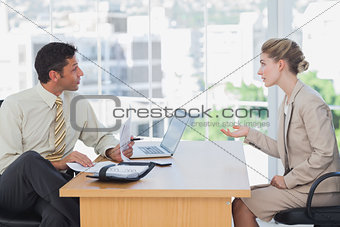 Businessman interviewing a businesswoman