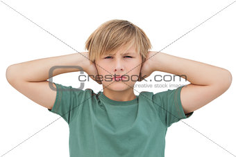 Blonde boy covering his ears