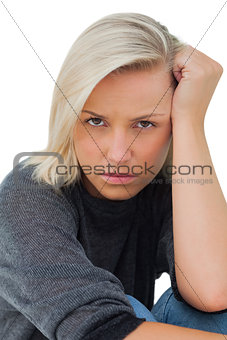 Troubled woman looking at camera