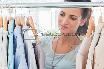 Attractive fashion woman looking at clothes