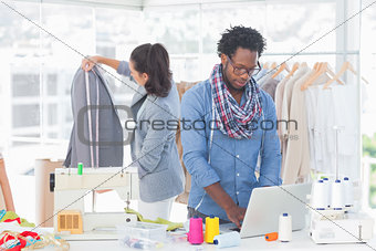 Fashion designer working on laptop