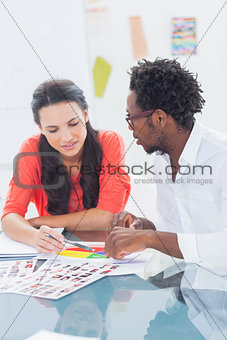 Two designers working on a colour wheel