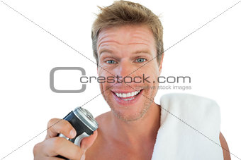 Handsome man holding an electric razor