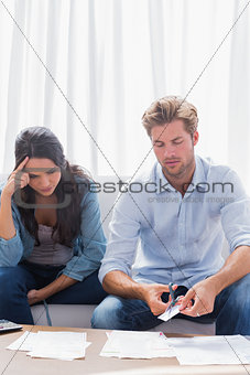 Worried couple doing their accounts together