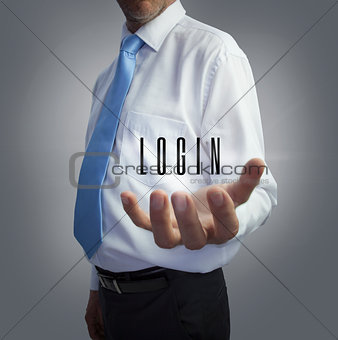 Businessman holding the word login
