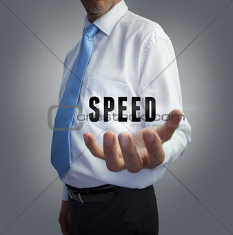 Businessman holding the word speed