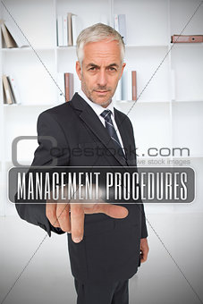 Businessman selecting the term management procedures