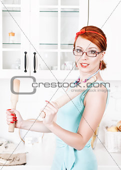 Beautiful housewife with utensils