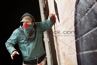 Worried Gang Member Spray Painting