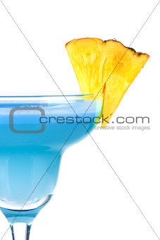 Blue alcohol cocktail with pineapple