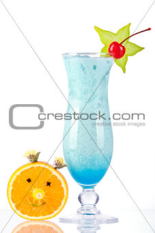 Blue tropical cocktail with coconut cream and orange face