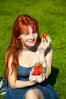 woman with a bowl of strawberries