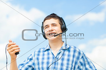 Smiling boy with headphones and Mic