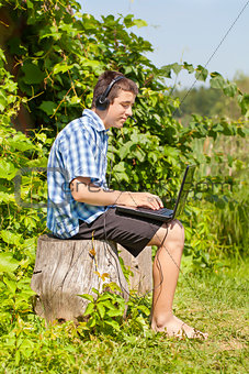 Boy with headphones, Mic and PC