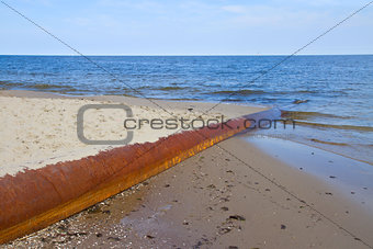 rusted pipe in  blue sea