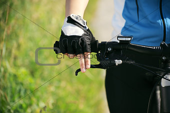 young woman training on mountain bike and cycling in park