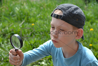 the teenager with a magnifying glass