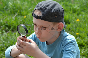 the teenager with a magnifying glass