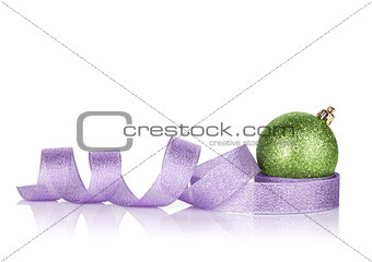 Green sparkling christmas bauble with purple ribbon