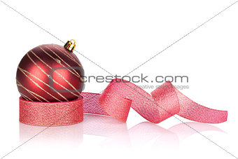 Red sparkling christmas bauble with ribbon