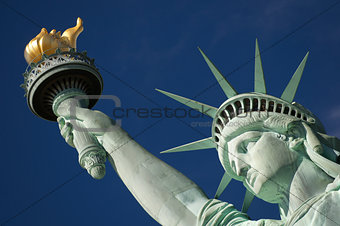 Close-up Portrait of Statue of Liberty Bright Blue Sky Torch