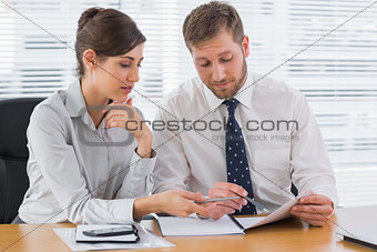 Business people going over documents