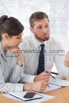 Business people chatting over documents