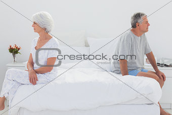 Mature woman sulking in bed during a conflict