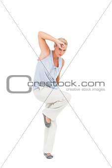 Blonde woman posing and looking at camera