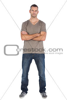Focused man with arms crossed