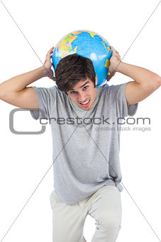 Man holding a globe on his back