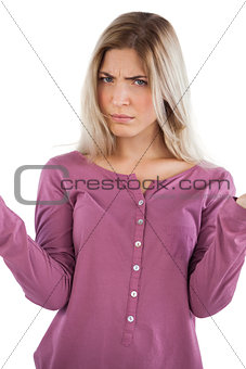 Concerned woman with hands raised