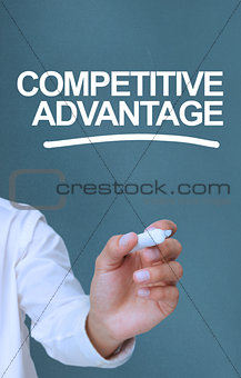 Businessman writing competitive advantage