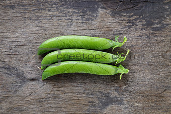 fresh pea pods in a row