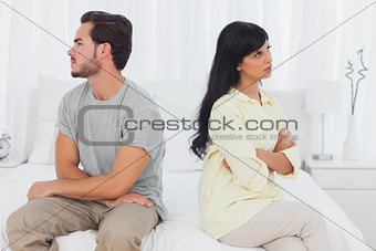 Couple sulking with arms crossed