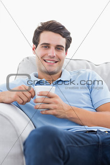 Portrait of a smiling man holding a cup of coffee