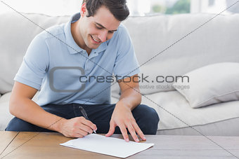 Man writing on a paper