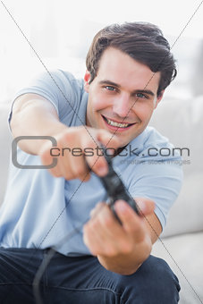 Portrait of a cheerful man playing video games