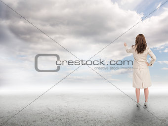 Businesswoman touching at the sky