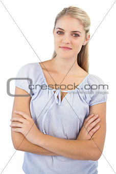 Smiling woman crossing her arms